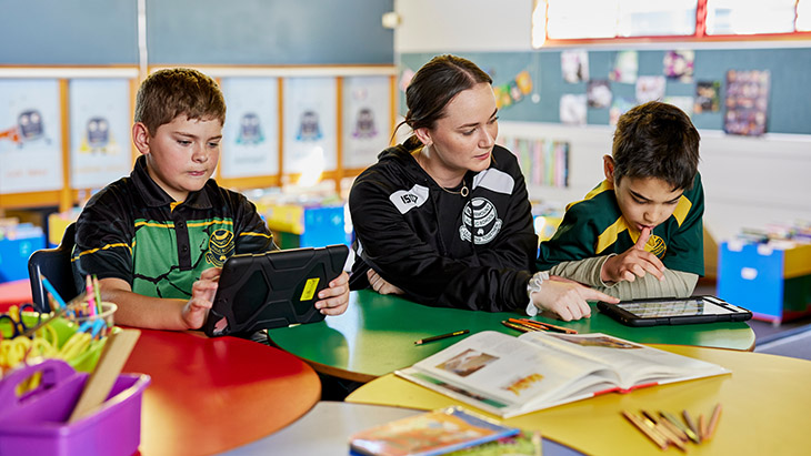 Students using technology in the classroom.