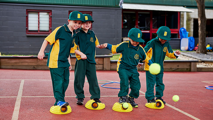 Student playing sport in the playground.