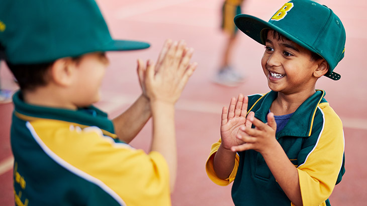 Students playing together in the school playground.